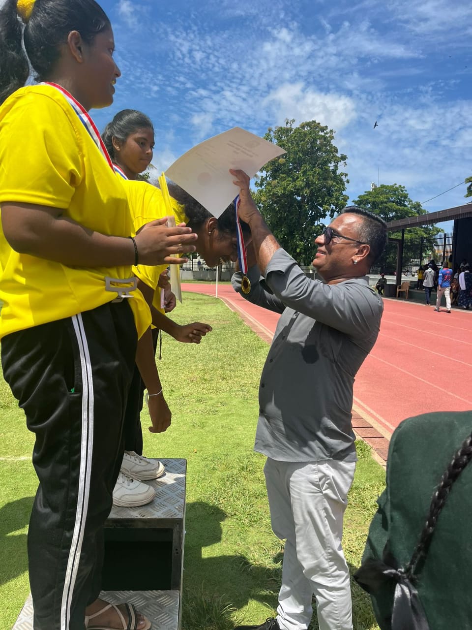 Recognizing young athletes at a community event